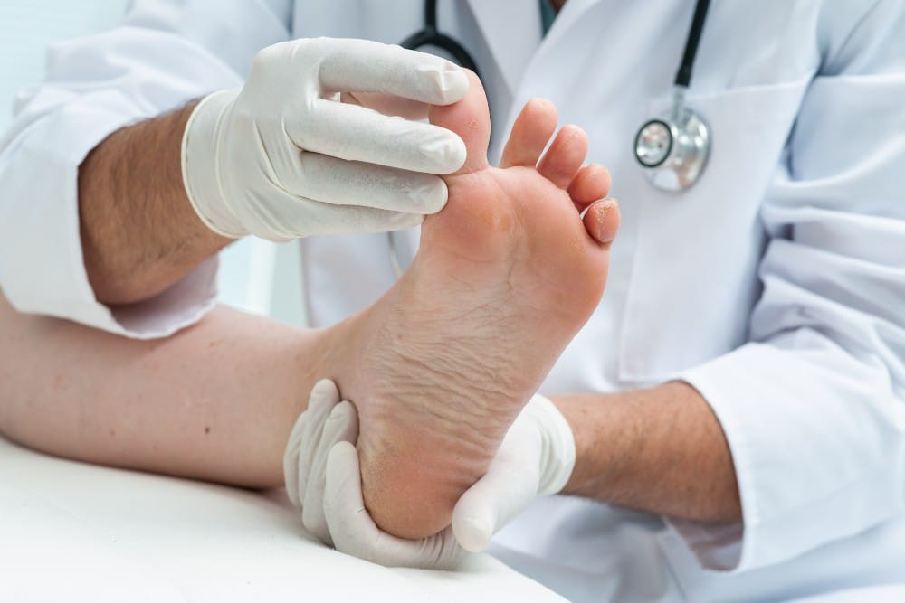 Podiatrist looking at toes